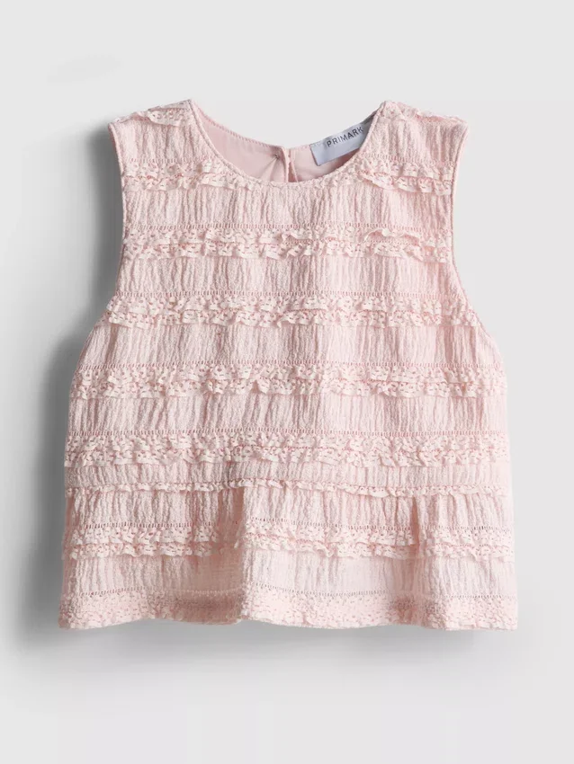 1,5–9 v. | peplum-mallinen hihaton pusero