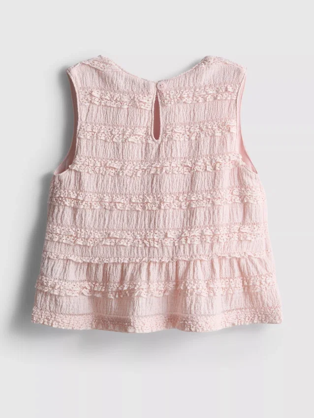 1,5–9 v. | peplum-mallinen hihaton pusero