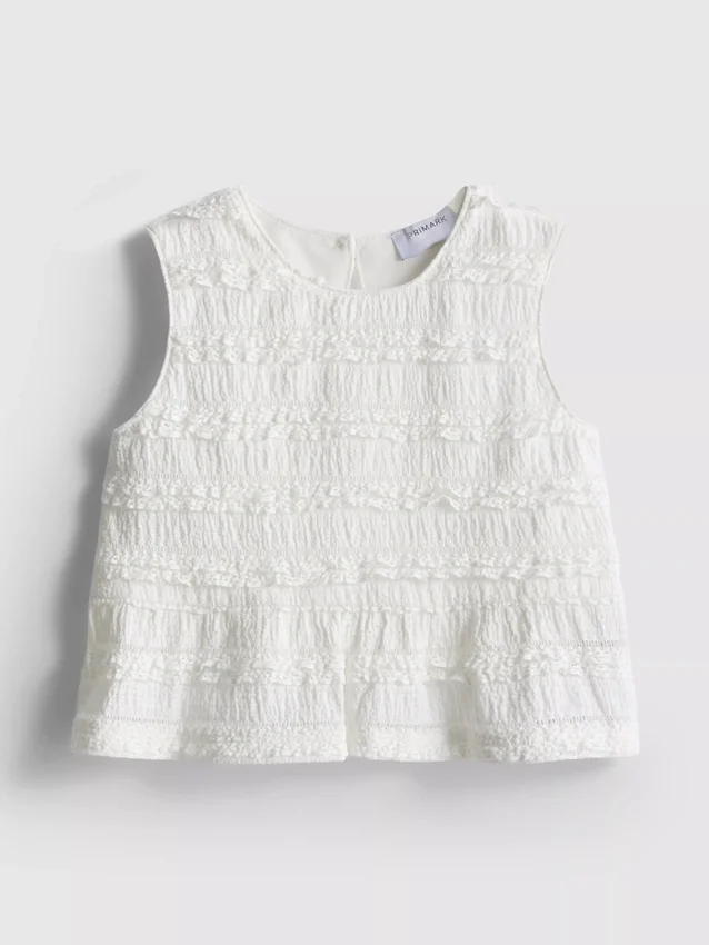1,5–9 v. | peplum-mallinen hihaton pusero