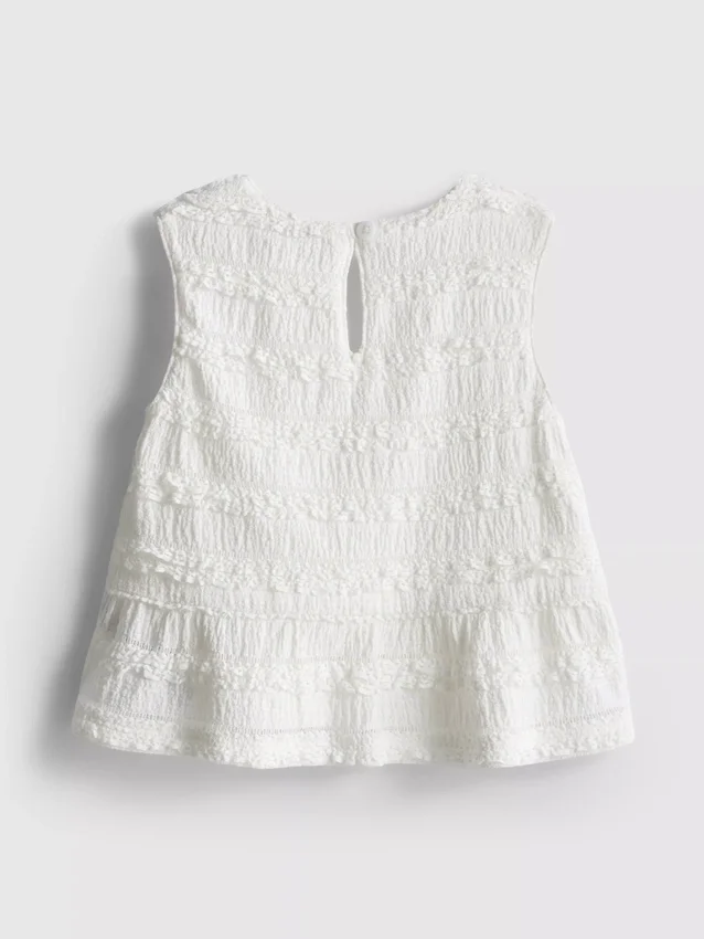 1,5–9 v. | peplum-mallinen hihaton pusero