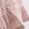 1,5–9 v. | peplum-mallinen hihaton pusero