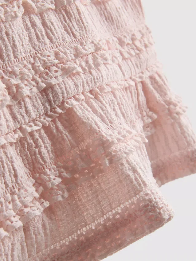 1,5–9 v. | peplum-mallinen hihaton pusero
