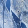 Broderie-koristeltu sivusidottava toppi