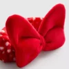Disneyn Minnie Mouse -pehmopäähine, jossa on rusetti