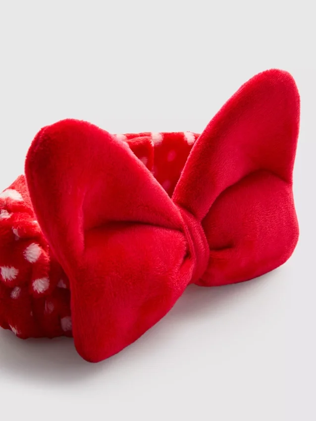 Disneyn Minnie Mouse -pehmopäähine, jossa on rusetti