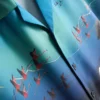Flamingokuvioinen lyhythihainen kauluspaiti