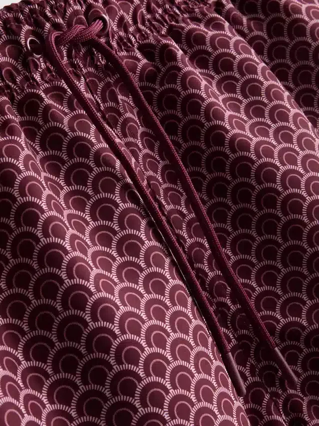 Geometriset uimahousut, joissa on kiristysnauha
