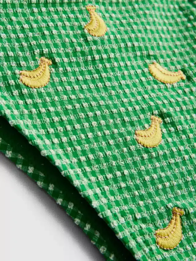 Gingham-kuvioiset, sivusta solmittavat banaanimalliset bikinialushousut