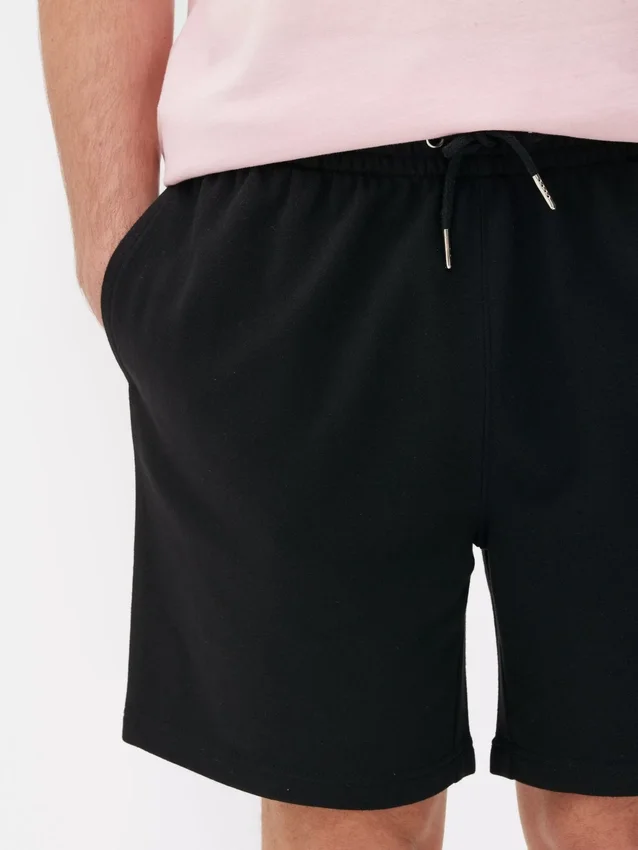 Kiristysnauhalliset jersey-shortsit