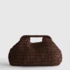 Kudottu clutch-laukku