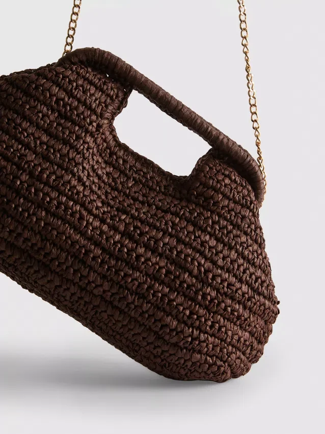 Kudottu clutch-laukku