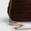 Kudottu clutch-laukku