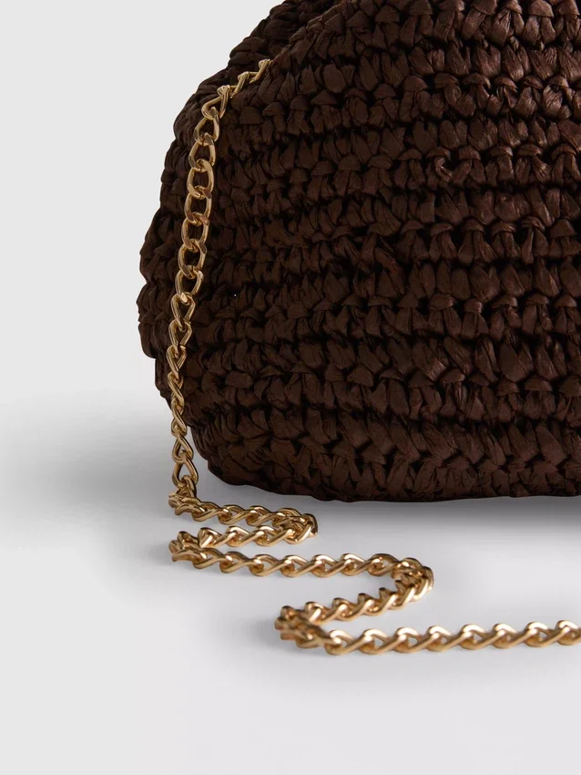 Kudottu clutch-laukku