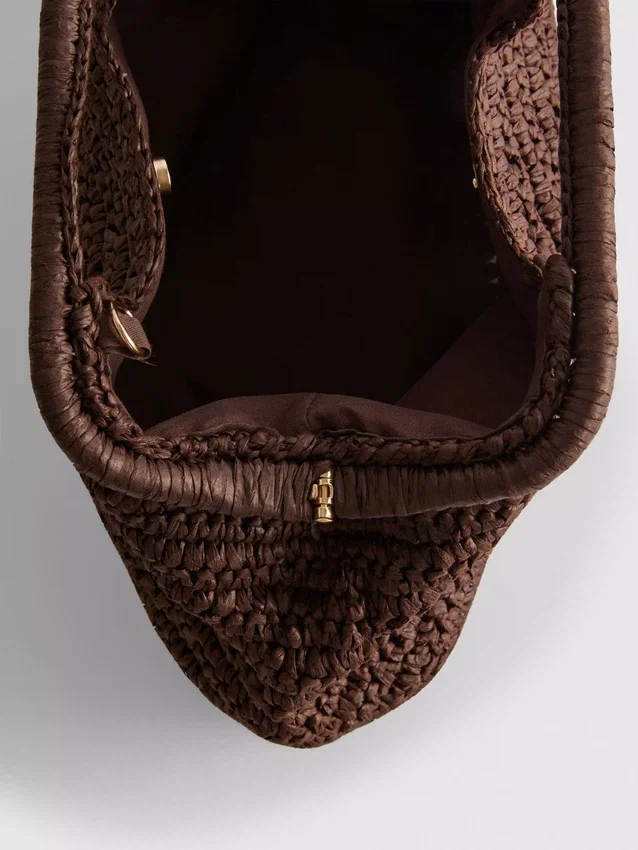 Kudottu clutch-laukku