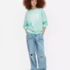 Miami-kirjaimin koristeltu oversized-huppari