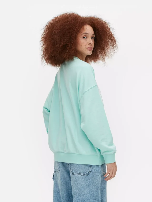 Miami-kirjaimin koristeltu oversized-huppari