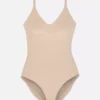 Muotoiltu muotoilevat alusvaatteet -bodysuit