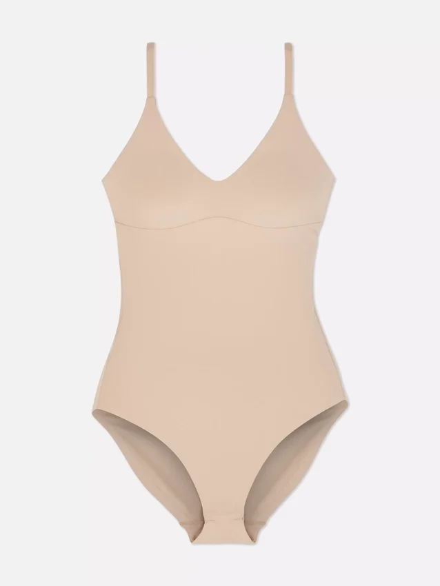 Muotoiltu muotoilevat alusvaatteet -bodysuit