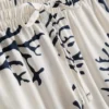 Painetut korallinväriset pyjamat-shortsit
