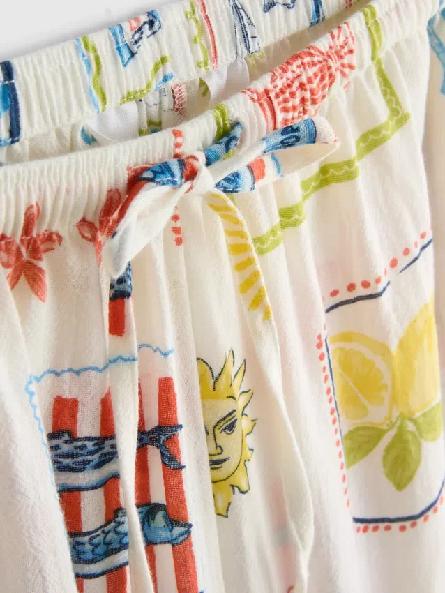 Painetut leveälahkeiset rantahousut