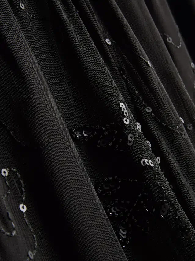 Paula Echevarría -helmillä koristellut verkkohousut, leveät lahkeet