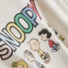 Peanuts-sarjan Snoopy-hahmolla koristeltu pyjama