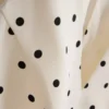 Pistekuvioinen halterneck-peplum-paita