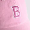 Primark-valikoima | brodeerattu nimikirjaimilla varustettu baseball-lippis