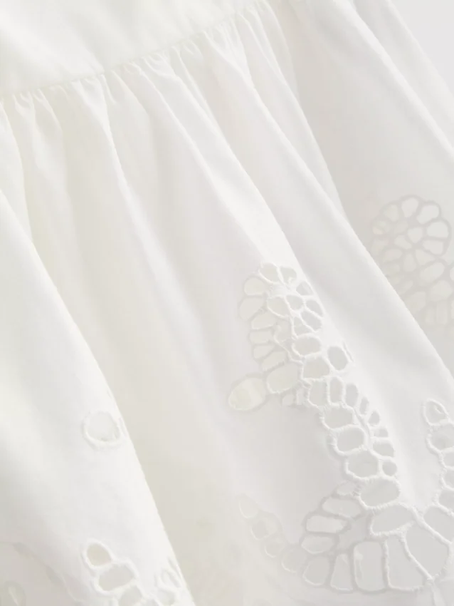 Puuvillainen, brodeerattu peplum-helkainen cami-toppi