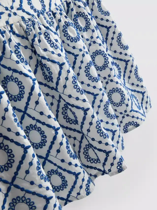 Puuvillainen cutwork-cami-toppi