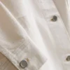 Puuvillainen denimtakki, jossa on paikkatasku