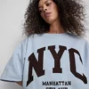 Puuvillapitoinen NYC-huppari, jossa on laskeutuvat hihat