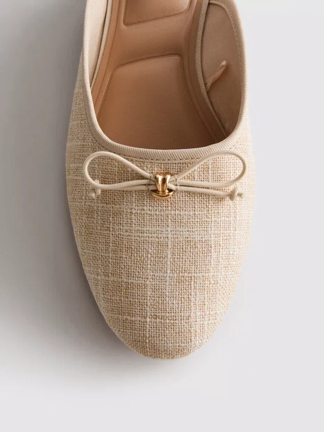 Rusettikoristeiset ballerina-mule-sandaalit