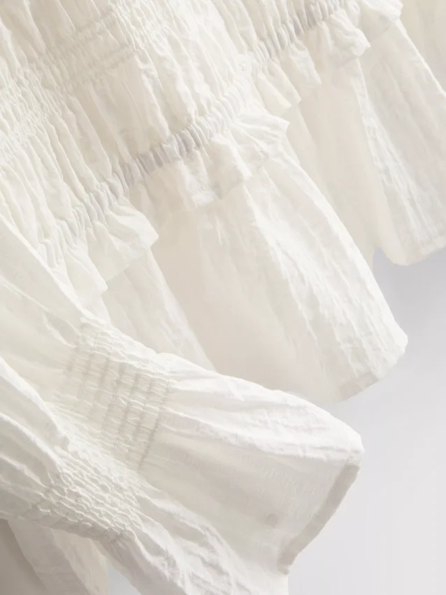 Rypytetty peplum-helmainen pusero