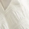 Rypytetty peplum-helmainen pusero