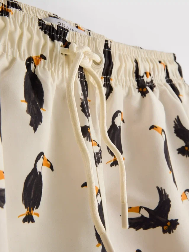 Toucan-shortsit, joissa on kiristysnauha vyötäröllä