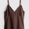 V-kaula-aukkoinen babydoll-top