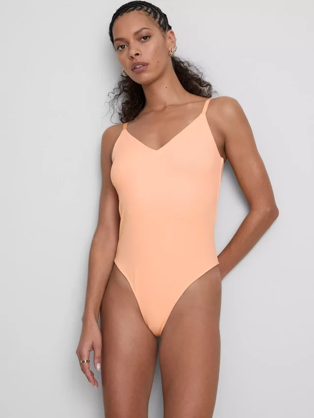 V-kaula-aukkoinen olkaimellinen bodysuit