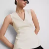 V-kaula-aukkoinen peplum-hihaton toppi