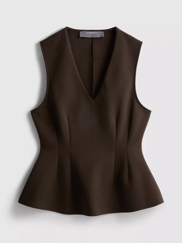 V-kaula-aukkoinen peplum-hihaton toppi