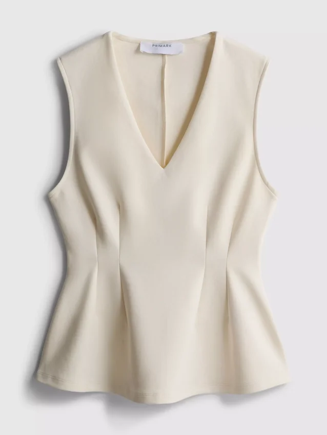 V-kaula-aukkoinen peplum-hihaton toppi