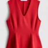 V-kaula-aukkoinen peplum-hihaton toppi