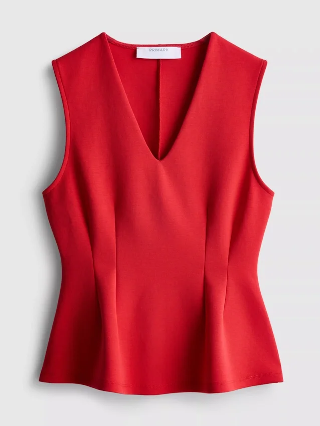 V-kaula-aukkoinen peplum-hihaton toppi