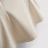 V-kaula-aukkoinen peplum-hihaton toppi