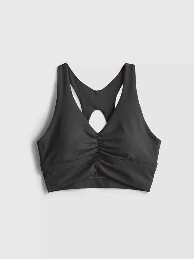 Voimaisen pehmeä urheilullinen rypytetty crop-toppi